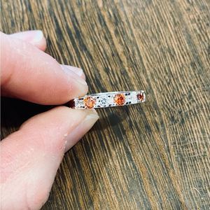 Spessartite (orange garnet) and CZ 925 eternity ring. Size 6. VIDEO. Very Shiny!